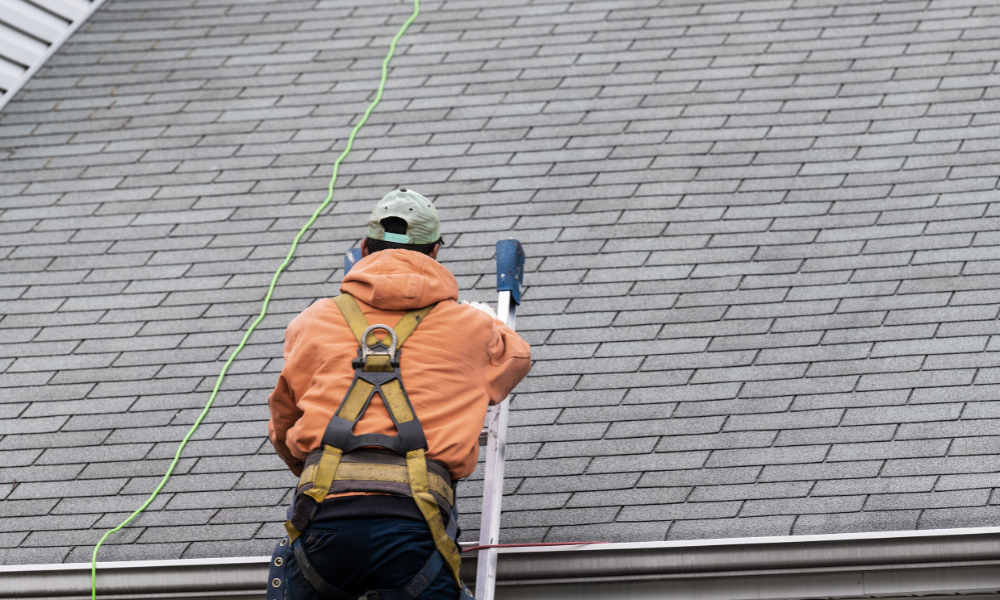 Roofers fixing tiles on a residential roof