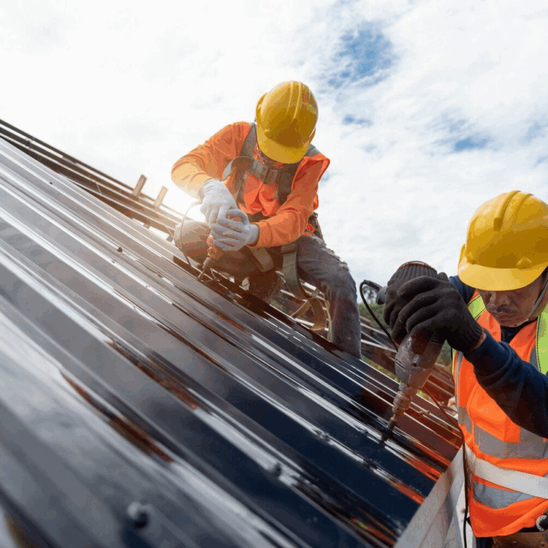 Contractor inspecting roof for cost estimate