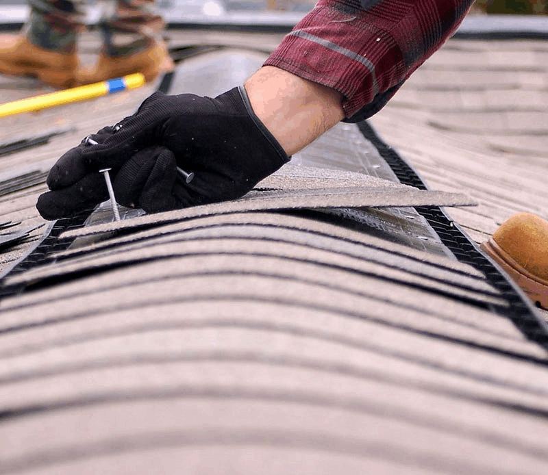 Roofing and restoration specialist repairing storm damage
