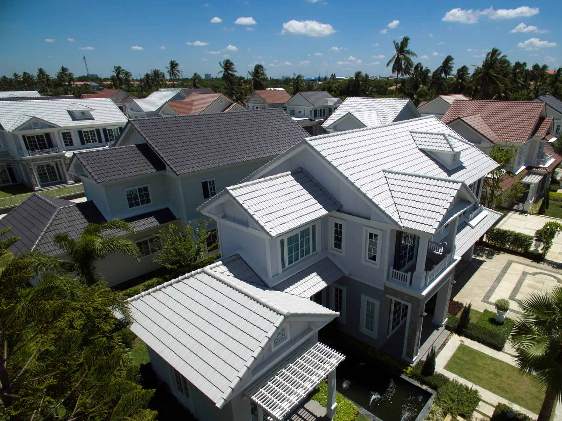 Tile roof restoration experts repairing damaged tiles